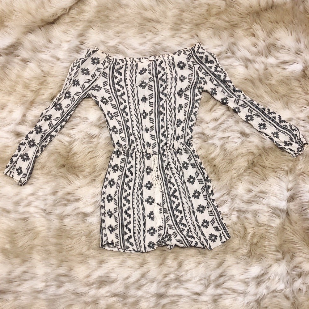 Off the shoulder tribal jumper with tie in front!